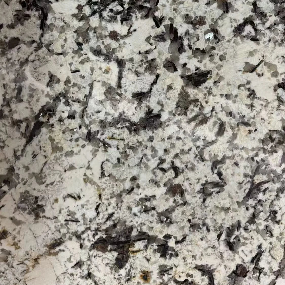 Arctic Mirage granite countertop with white base and dramatic black veining patterns