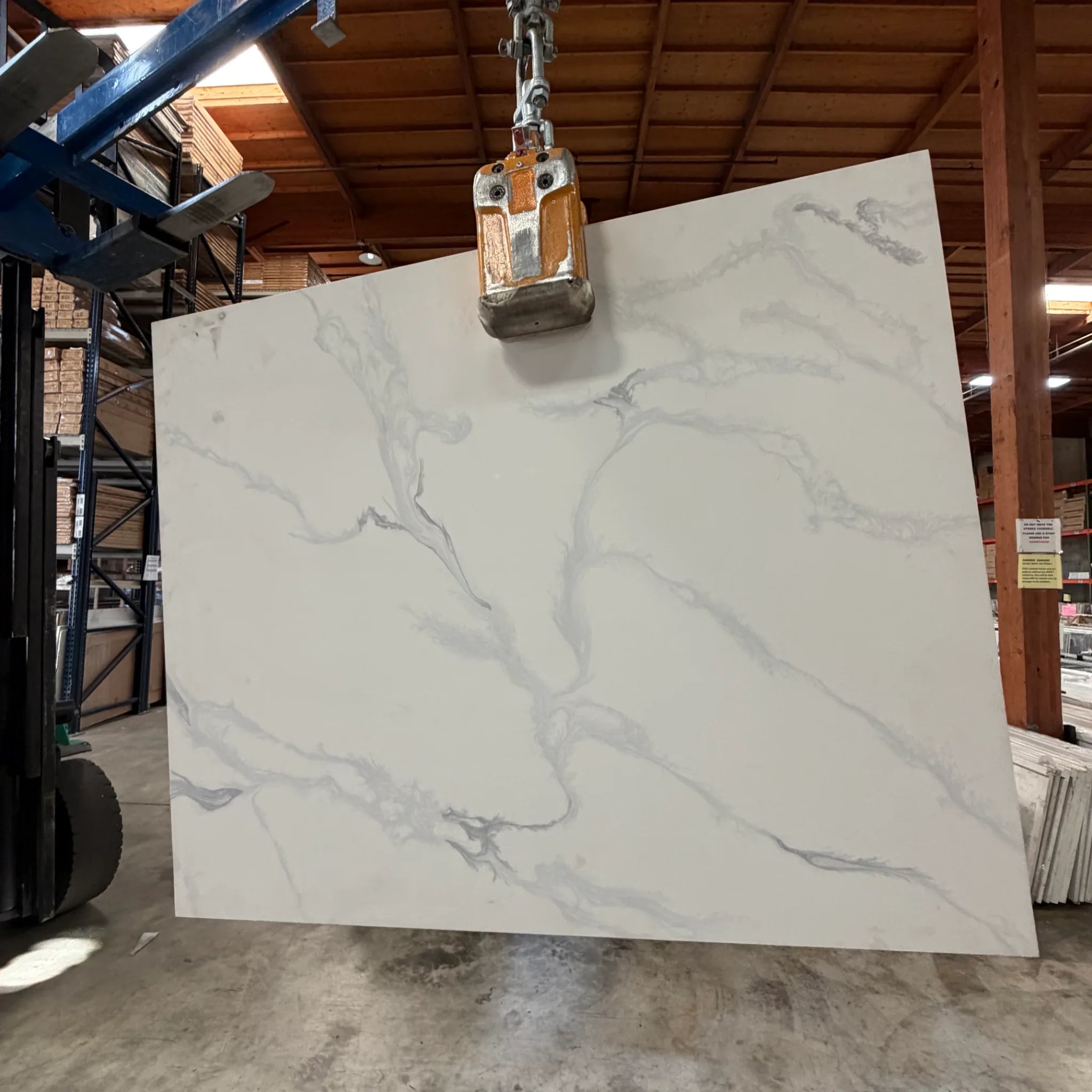 Versilia quartz slab with white background and soft gray veining at Apex Granite Outlet