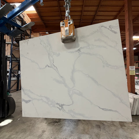 Versilia quartz slab with white background and soft gray veining at Apex Granite Outlet