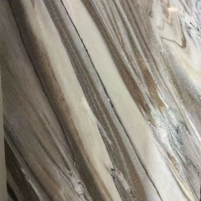 Calacatta Borghini quartz surface with dramatic gray and charcoal veining on white background